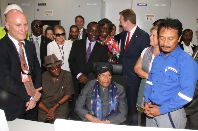 President Sirleaf and VP Boakai look on as the Big Light promised is turned on